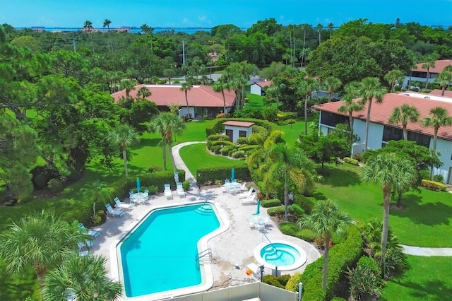 view of swimming pool featuring a yard and a patio