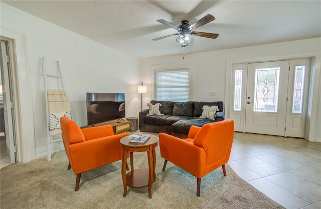 living room with ceiling fan and light tile patterned floors