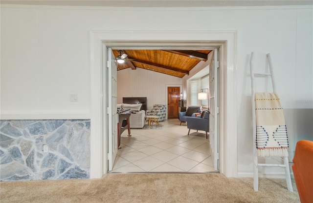 corridor featuring light carpet, lofted ceiling with beams, and wooden ceiling