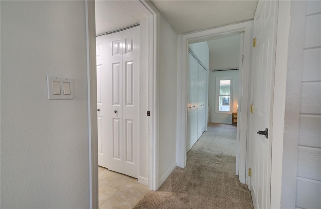 hallway with light carpet