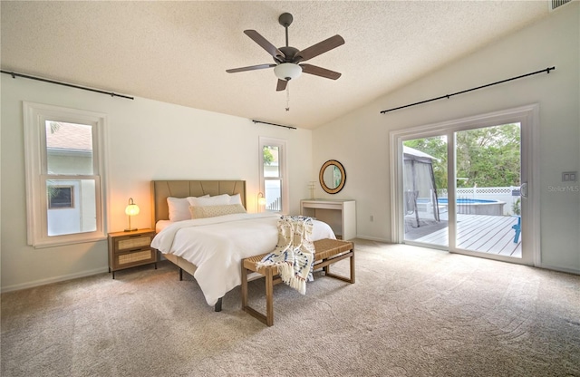 carpeted bedroom featuring lofted ceiling, access to outside, ceiling fan, and a textured ceiling