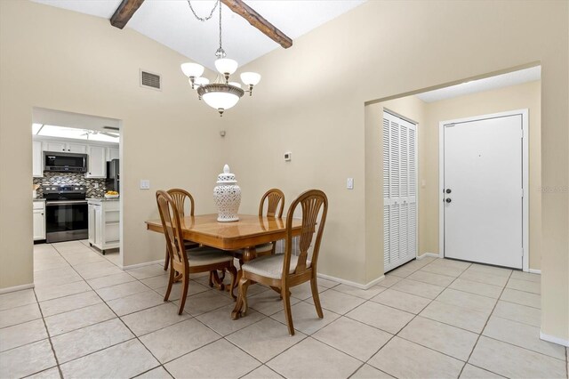 tiled dining area featuring lofted ceiling with beams and a chandelier