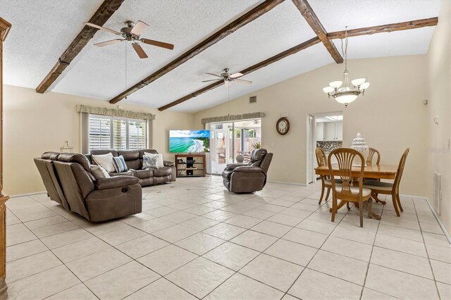 living room featuring a textured ceiling, ceiling fan with notable chandelier, lofted ceiling with beams, and light tile patterned floors