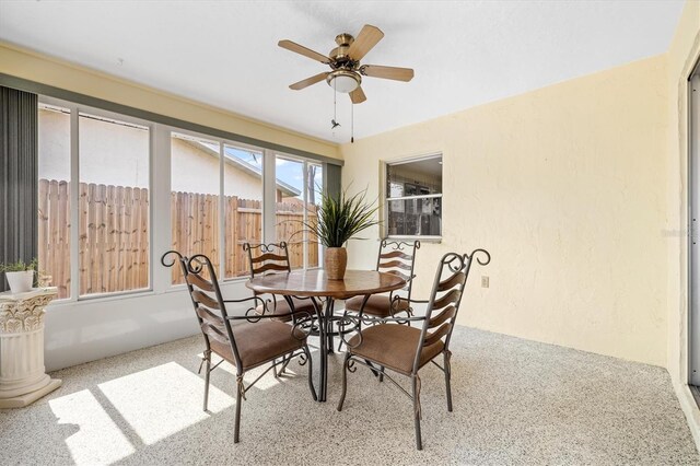 dining room featuring ceiling fan and light colored carpet