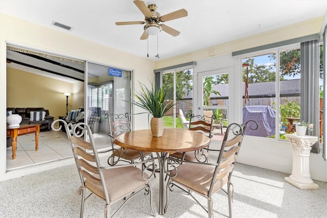 dining space with ceiling fan