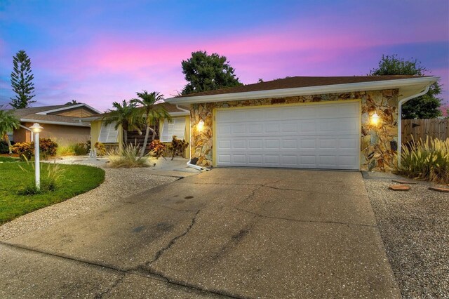 ranch-style home with a garage