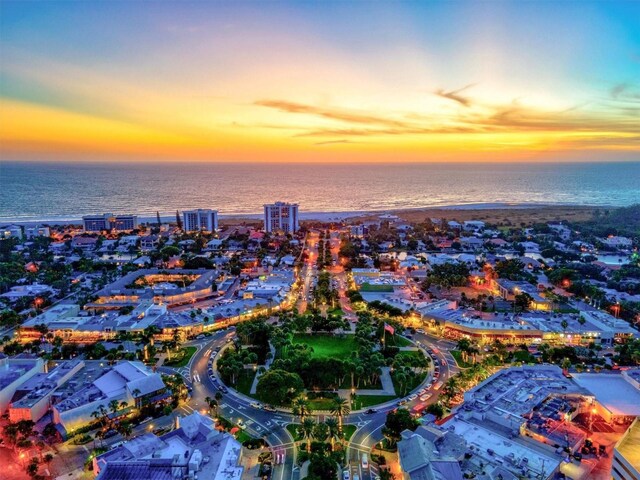 aerial view at dusk with a water view