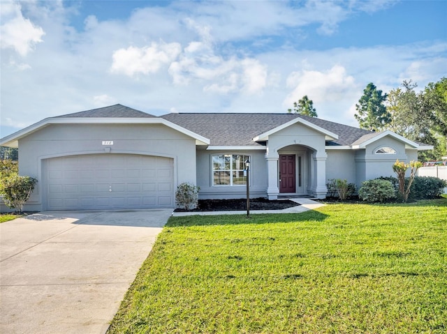 single story home with a garage and a front lawn