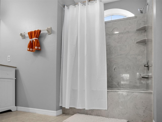 bathroom with tile patterned flooring and walk in shower