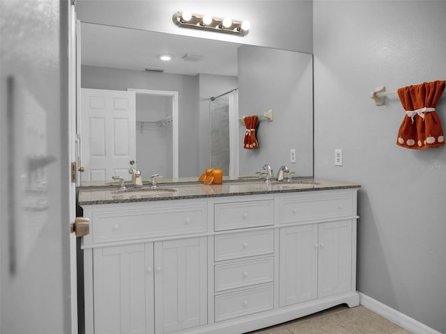 bathroom with vanity and tile patterned floors