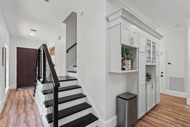 stairway featuring wood-type flooring