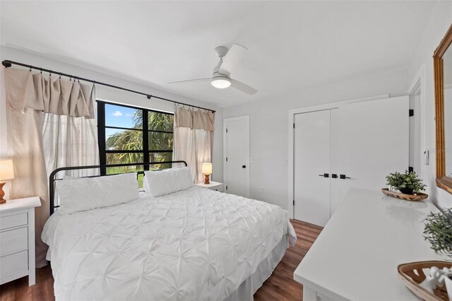 bedroom featuring dark hardwood / wood-style flooring and ceiling fan