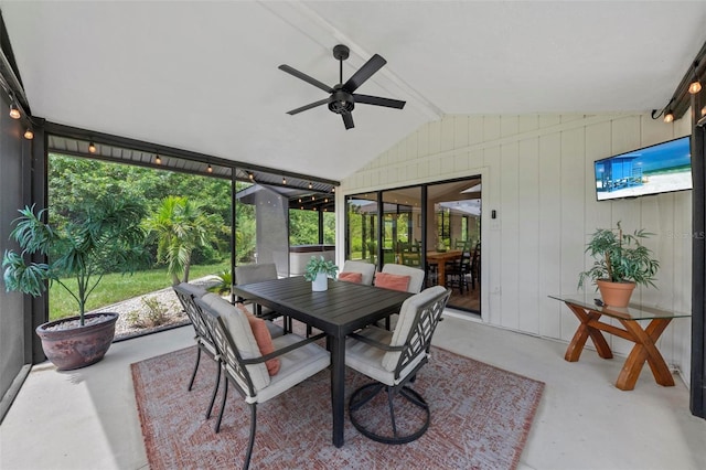 sunroom with ceiling fan and outdoor dining space