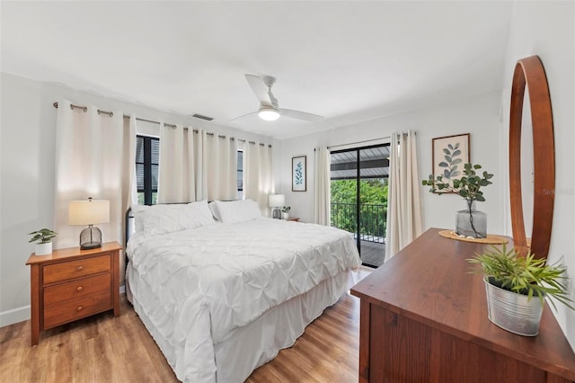 bedroom featuring ceiling fan, visible vents, light wood-style flooring, and access to exterior