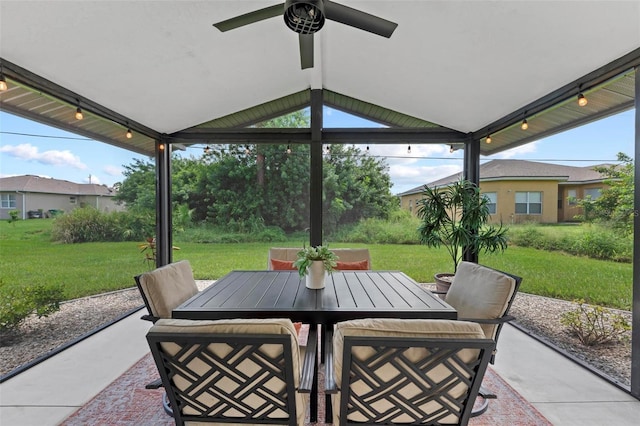view of patio with outdoor dining area and a ceiling fan