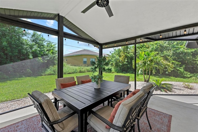 view of patio with outdoor dining area and ceiling fan