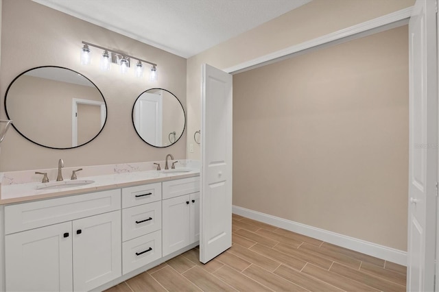 bathroom featuring vanity and a textured ceiling