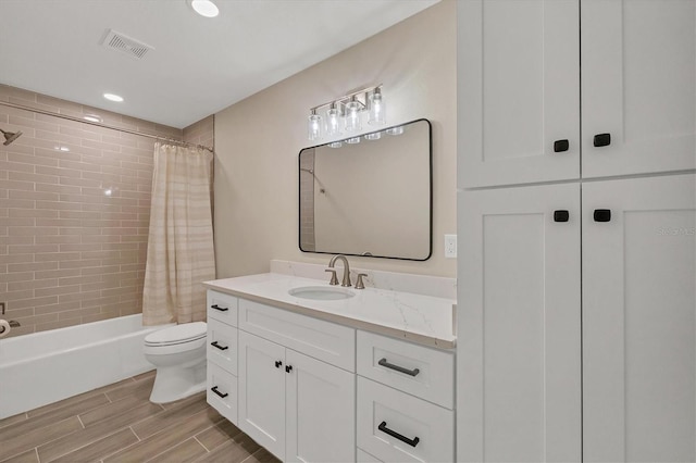 full bathroom featuring vanity, toilet, and shower / bath combo