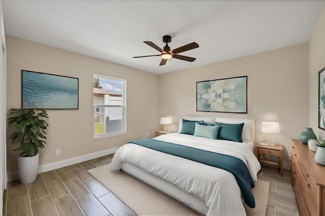 bedroom with ceiling fan and hardwood / wood-style flooring