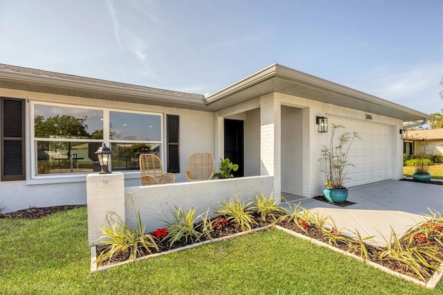 view of front of home with a garage and a front lawn