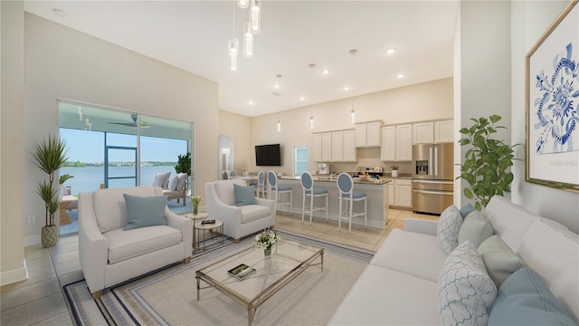 tiled living room with ceiling fan