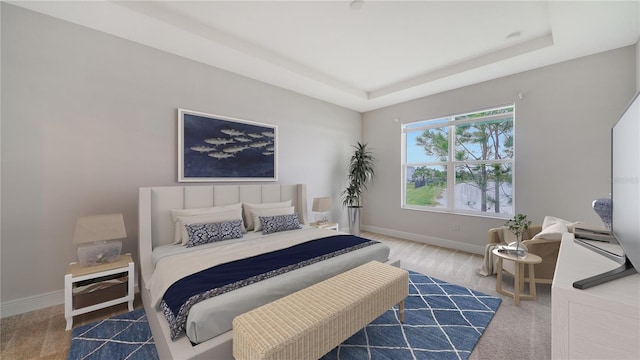 carpeted bedroom featuring a raised ceiling