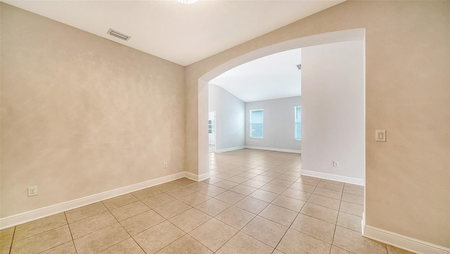 empty room featuring light tile patterned floors