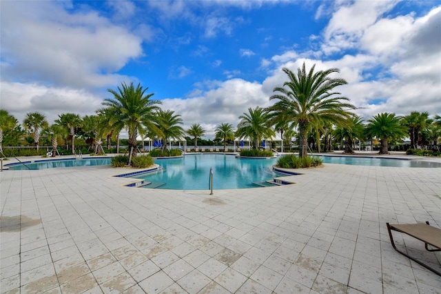 view of swimming pool featuring a patio area