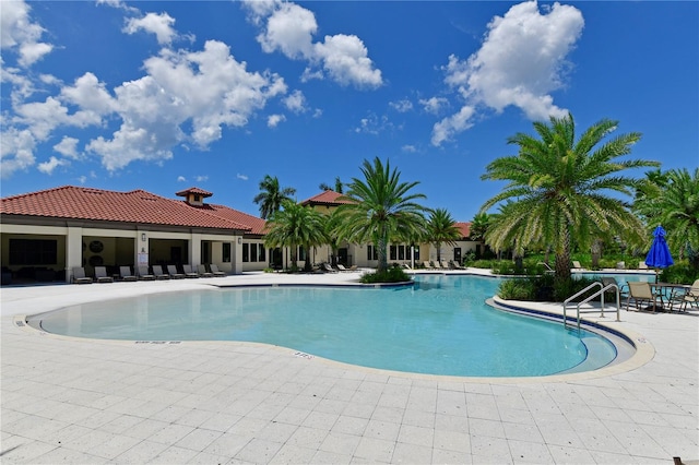 view of swimming pool with a patio area