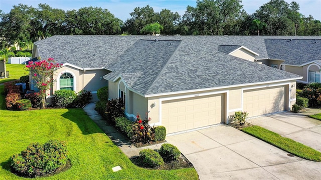 view of front of home with a garage and a front yard