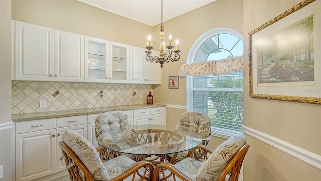 dining space with a notable chandelier and a wealth of natural light