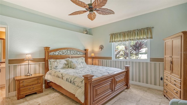 tiled bedroom with ceiling fan