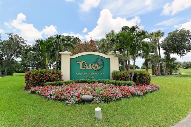 community / neighborhood sign with a lawn