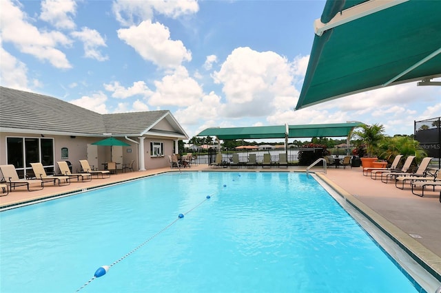 view of swimming pool featuring a patio