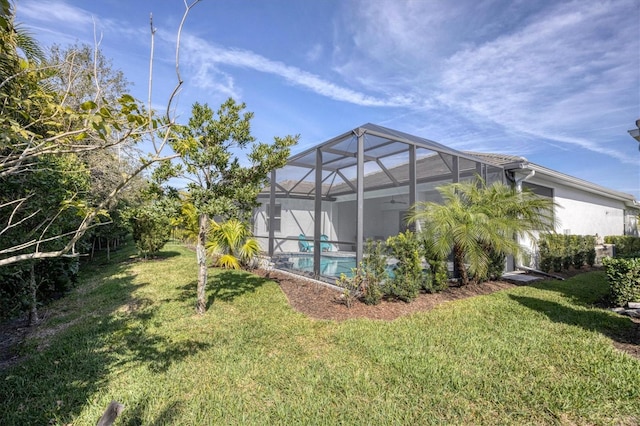 view of yard featuring a lanai