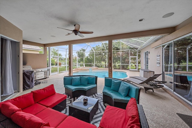 sunroom with ceiling fan