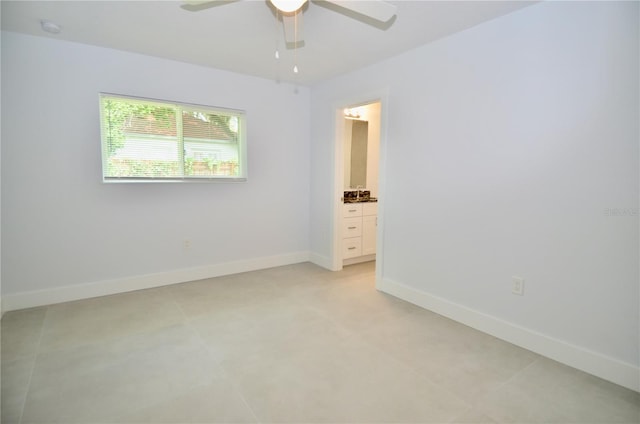 spare room featuring ceiling fan