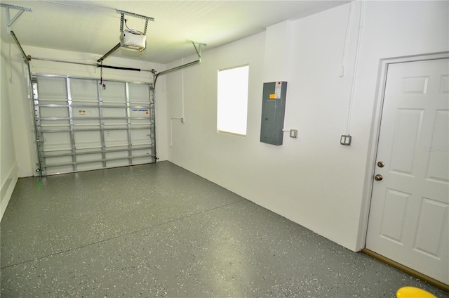 garage with electric panel and a garage door opener