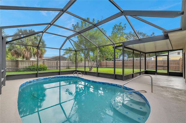 view of pool featuring a patio and glass enclosure