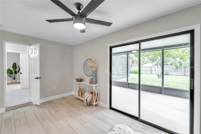 empty room featuring ceiling fan and light wood-type flooring