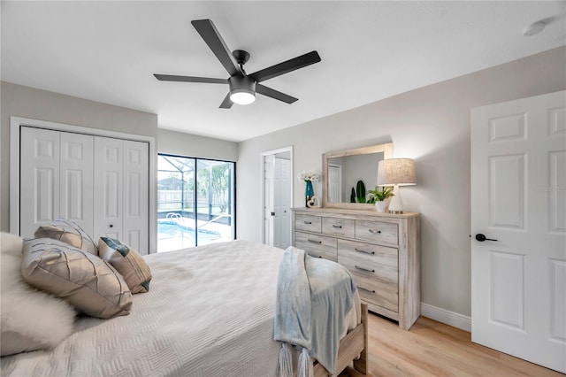 bedroom with access to outside, light hardwood / wood-style flooring, ceiling fan, and a closet