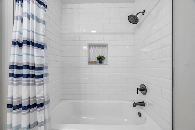 bathroom with shower / bath combo