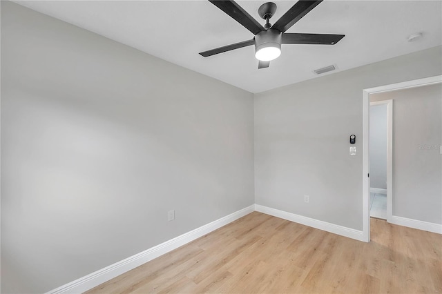 spare room with ceiling fan and light hardwood / wood-style floors