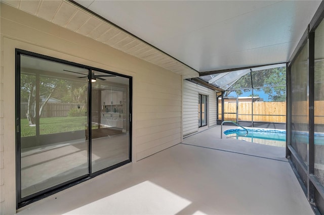 unfurnished sunroom with lofted ceiling