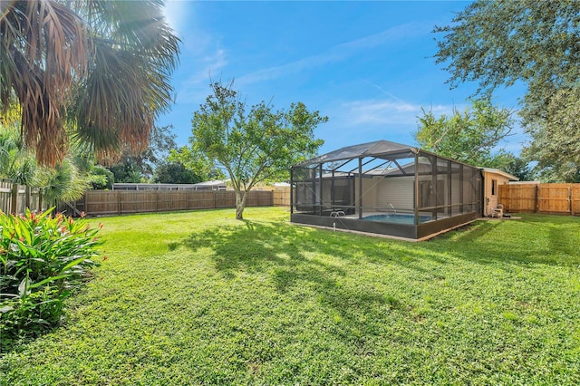 view of yard with a lanai