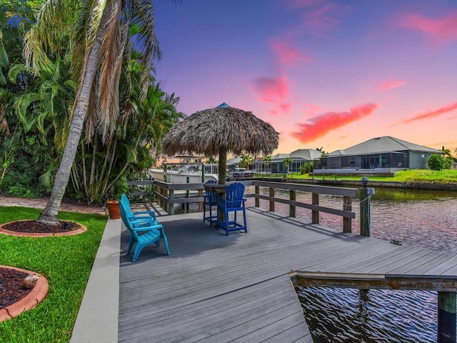 exterior space with a gazebo and a water view