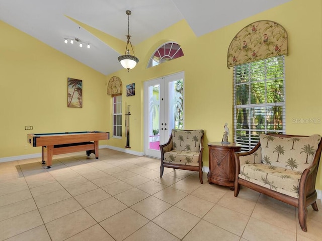 recreation room with billiards, french doors, tile patterned flooring, baseboards, and vaulted ceiling