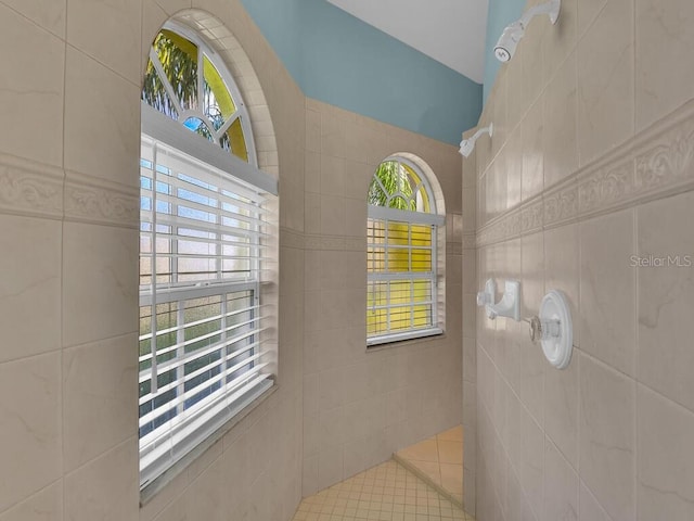 bathroom with a tile shower