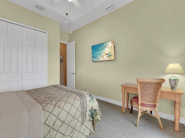 bedroom featuring carpet flooring, baseboards, visible vents, and a closet