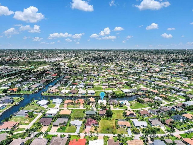 birds eye view of property featuring a residential view and a water view